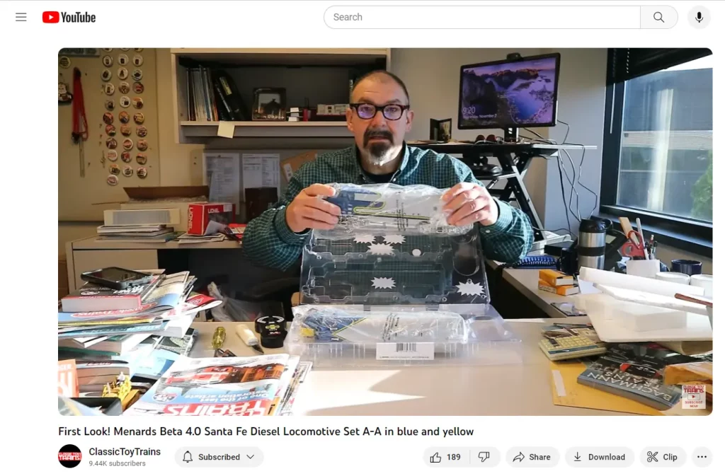 Man at desk showing locomotive