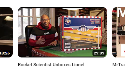 Man with big model train box